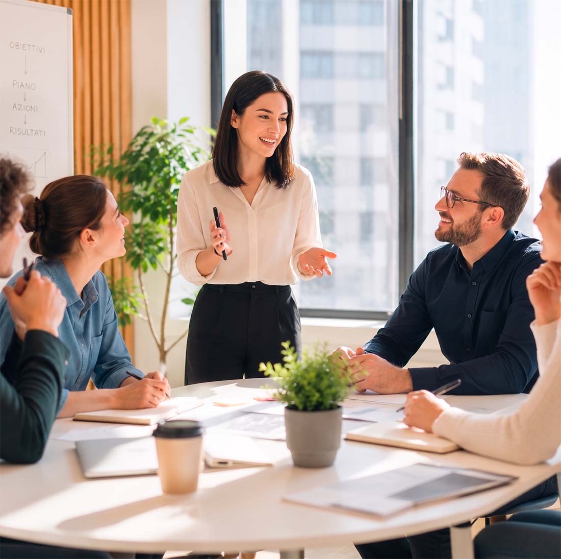 Sessione di coaching con persone intorno a un tavolo
